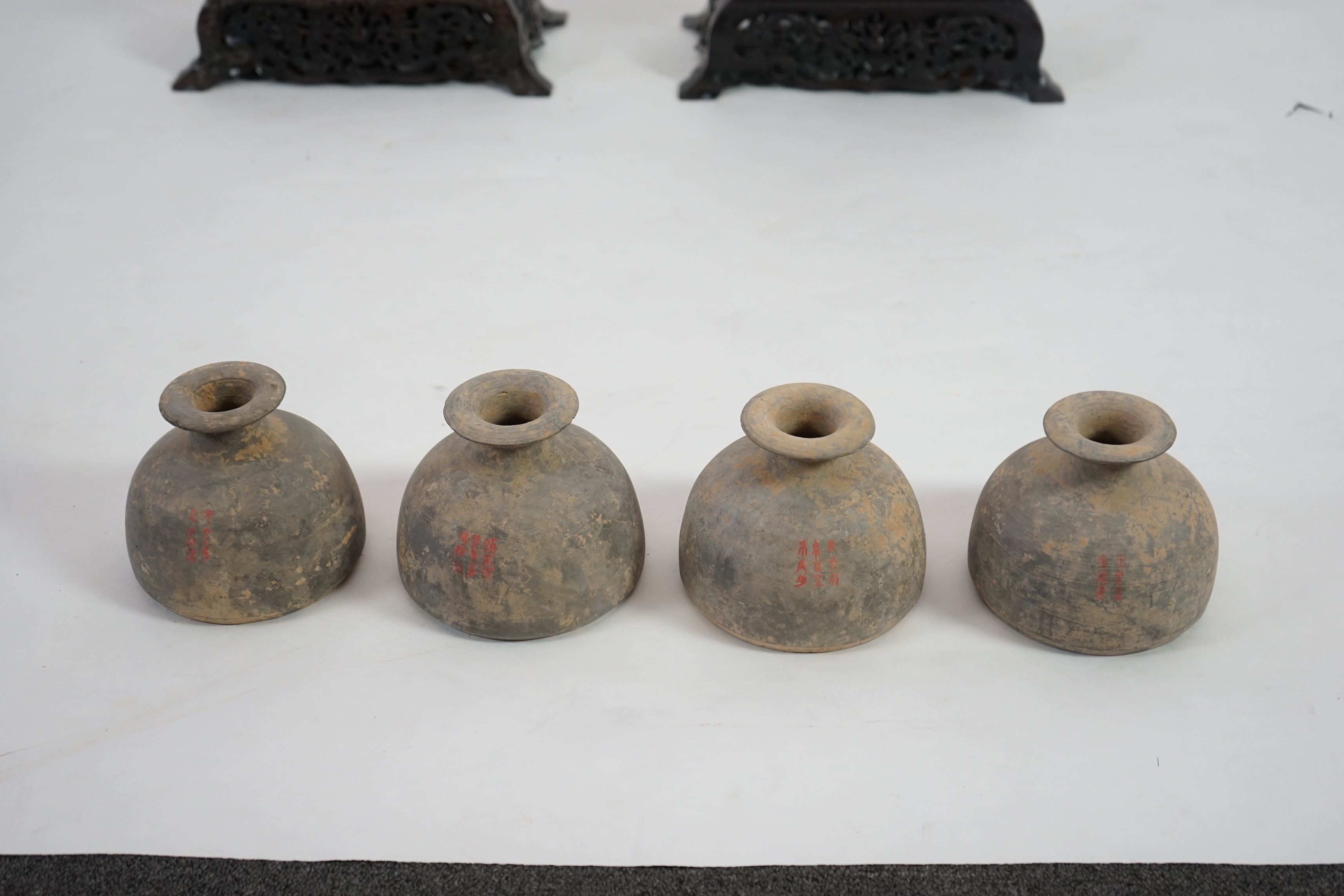 Four very rare Chinese inscribed pottery jars, Han dynasty